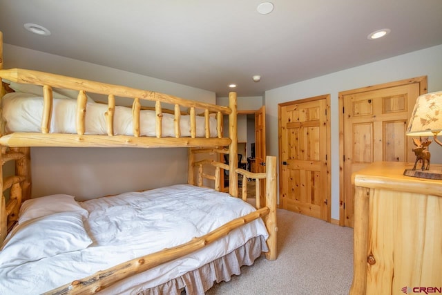 carpeted bedroom featuring recessed lighting