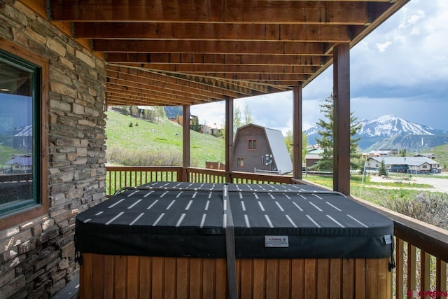 wooden deck with a mountain view