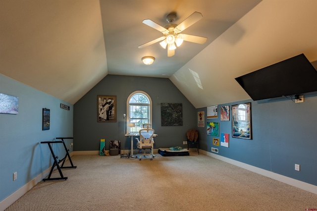 recreation room featuring lofted ceiling, ceiling fan, carpet flooring, and baseboards