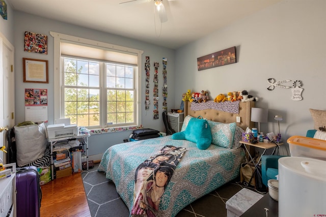 bedroom with wood finished floors and a ceiling fan