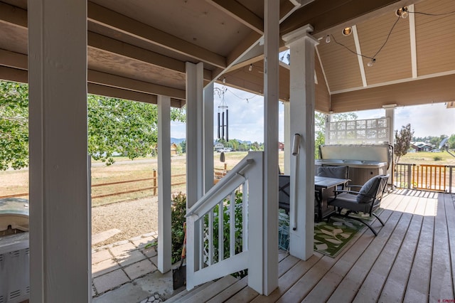 deck featuring a hot tub