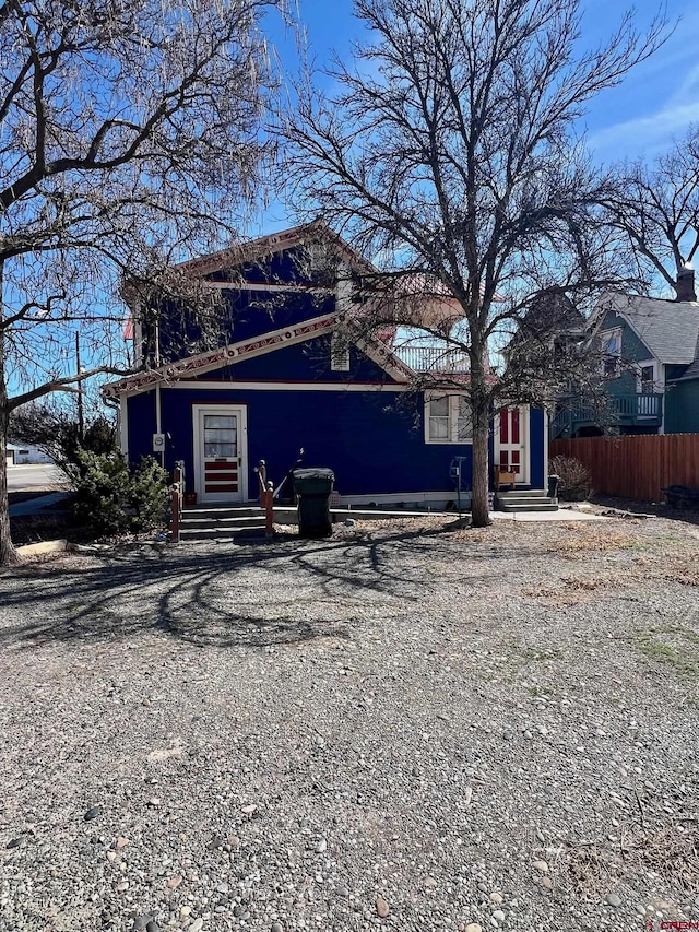 view of front of property featuring fence