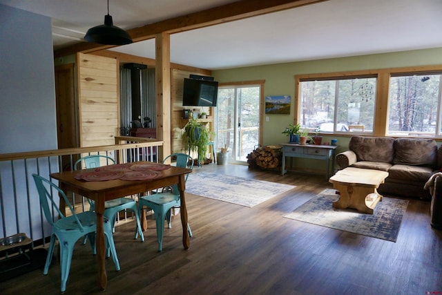 interior space with beamed ceiling and wood finished floors