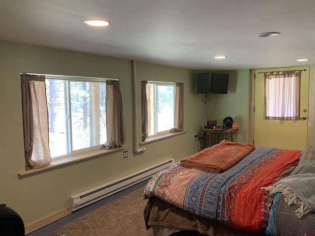 bedroom featuring recessed lighting, baseboards, and baseboard heating