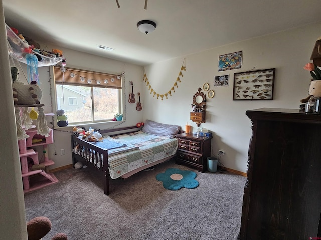 carpeted bedroom with baseboards and visible vents