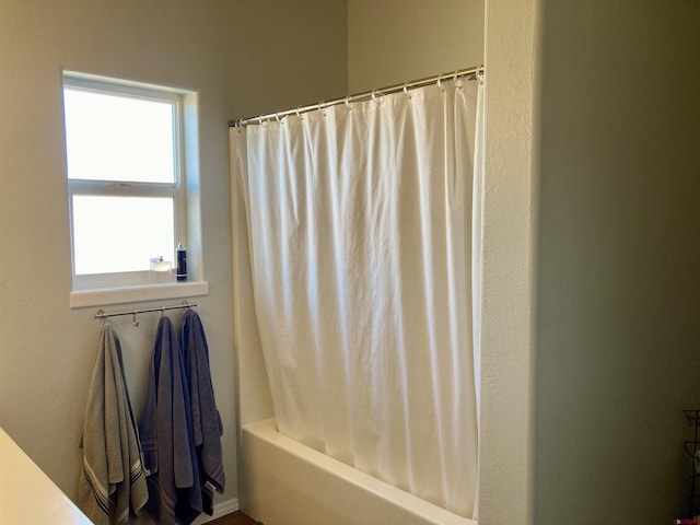 full bath featuring shower / bath combo with shower curtain