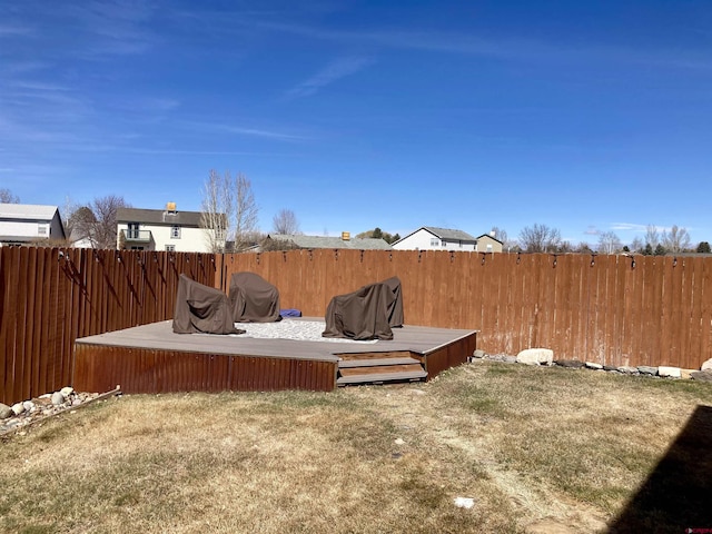 view of yard featuring a deck and fence