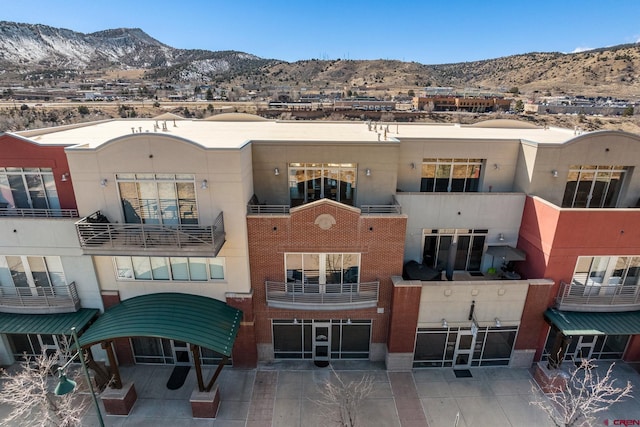 view of building exterior featuring a mountain view