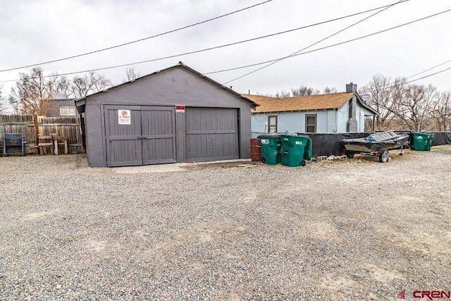 detached garage with fence