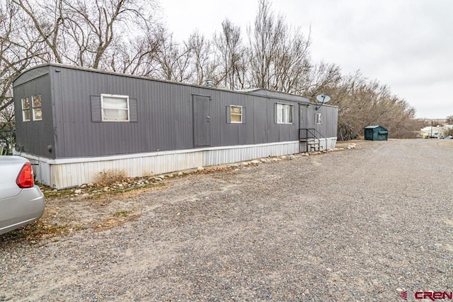 view of home's exterior featuring gravel driveway