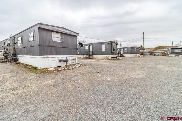 view of side of property with driveway