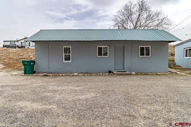 view of front of property featuring metal roof