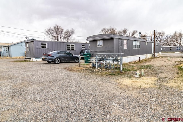 manufactured / mobile home with gravel driveway