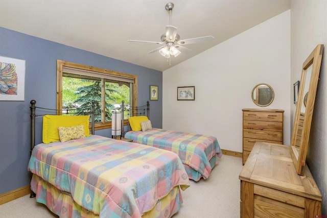 bedroom with light carpet, baseboards, lofted ceiling, and a ceiling fan