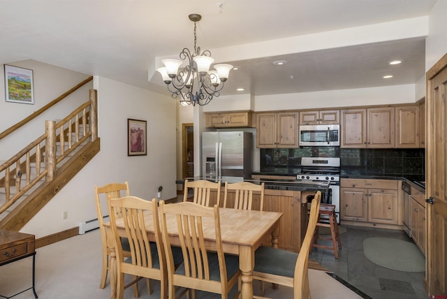 kitchen featuring a baseboard heating unit, dark countertops, recessed lighting, appliances with stainless steel finishes, and decorative backsplash