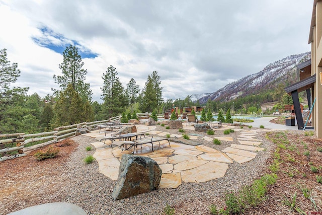 view of yard with a patio and a mountain view