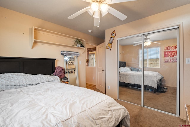 bedroom with a closet, a ceiling fan, and carpet floors