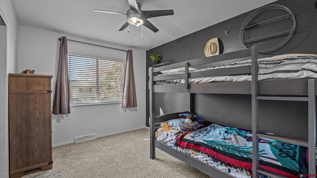 bedroom featuring visible vents, carpet flooring, baseboards, and ceiling fan