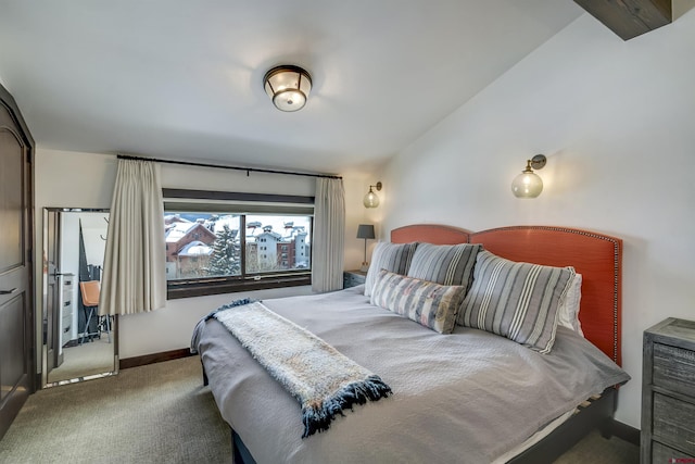 bedroom featuring baseboards and carpet flooring