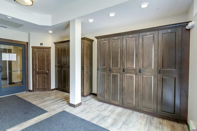 interior space with visible vents and baseboard heating