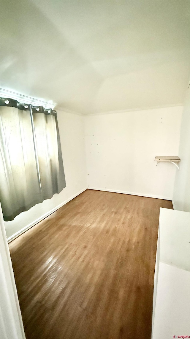 unfurnished room featuring wood finished floors