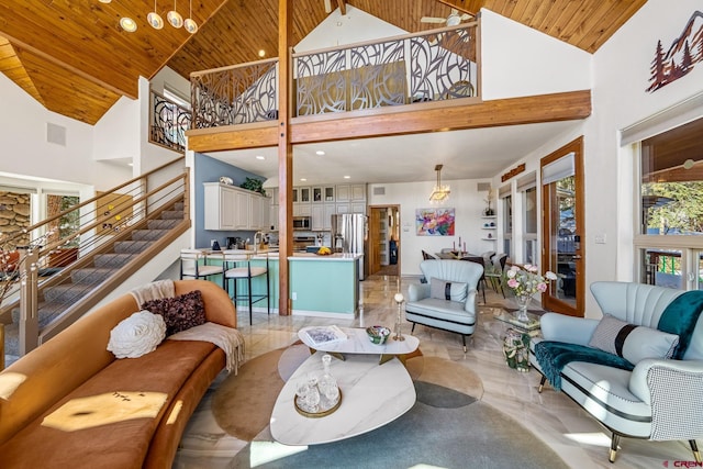 living room featuring visible vents, high vaulted ceiling, wooden ceiling, and stairs