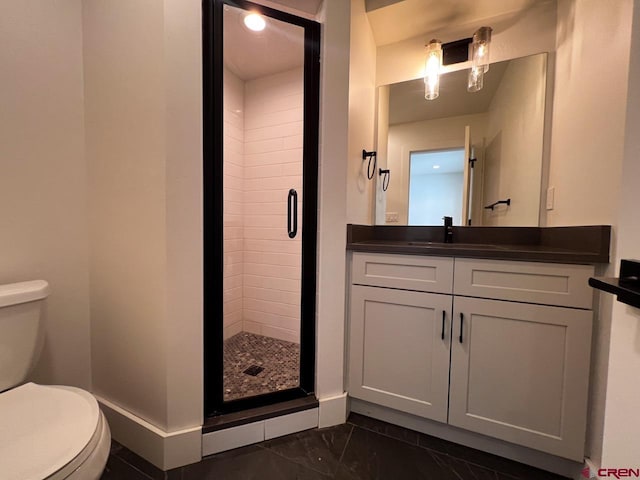 full bath featuring vanity, baseboards, a stall shower, toilet, and marble finish floor