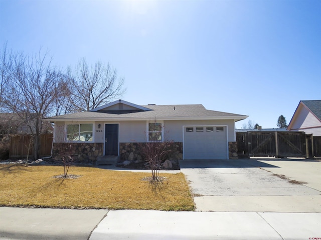 single story home featuring a front lawn, fence, stucco siding, a garage, and driveway