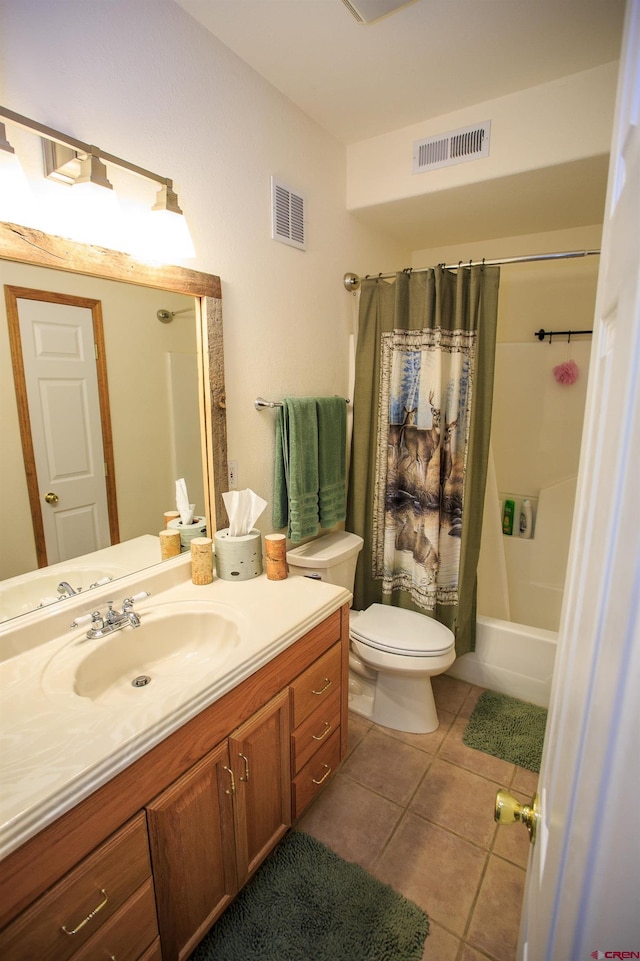 bathroom with tile patterned flooring, visible vents, toilet, and vanity