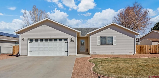 ranch-style house with a front lawn, concrete driveway, an attached garage, and fence