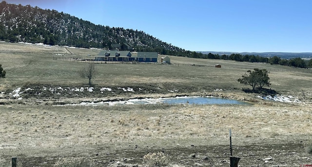 exterior space with a mountain view and a rural view