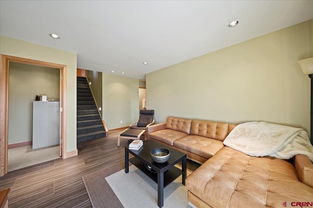 living area featuring recessed lighting, baseboards, wood finished floors, and stairs