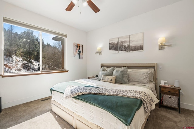 bedroom with visible vents, carpet, baseboards, and ceiling fan