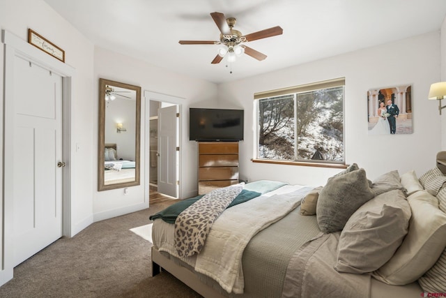 carpeted bedroom with a ceiling fan and baseboards