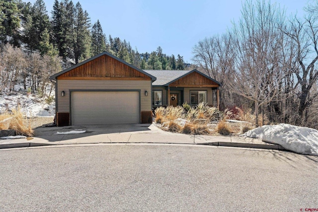 view of front of property with concrete driveway and an attached garage