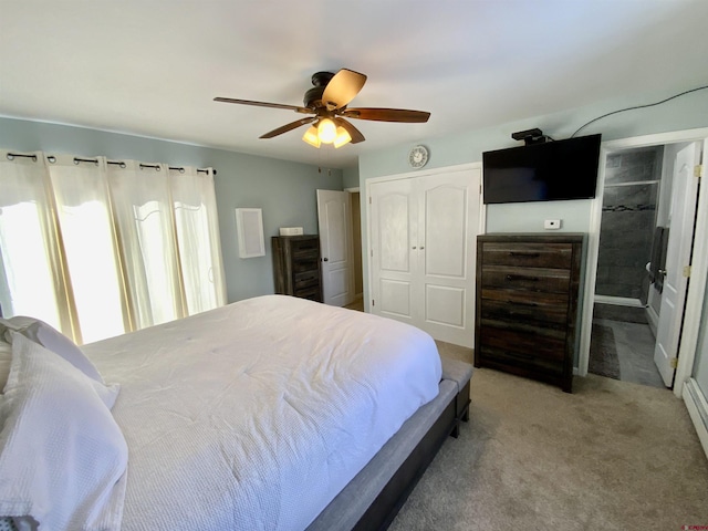 carpeted bedroom with a closet and ceiling fan