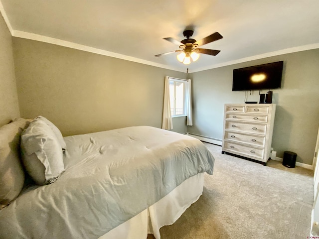 bedroom with carpet flooring, crown molding, a baseboard heating unit, and baseboards