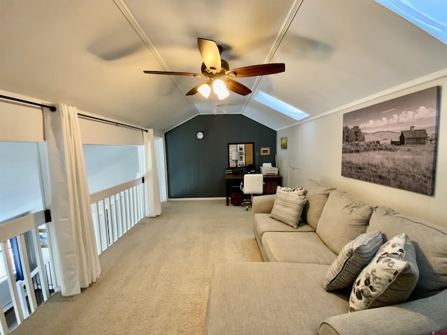 carpeted living room featuring vaulted ceiling with skylight and a ceiling fan