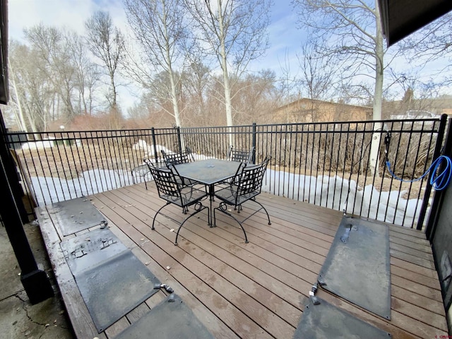 wooden terrace with outdoor dining area