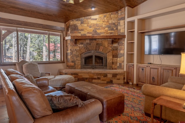 living room with wooden ceiling, lofted ceiling, built in shelves, and wood finished floors