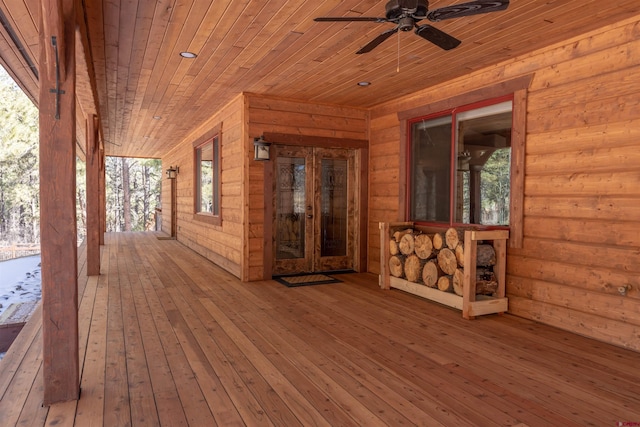 wooden deck with a ceiling fan