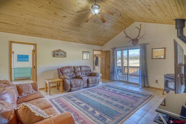 living room with wooden ceiling, tile patterned flooring, lofted ceiling, ceiling fan, and a wood stove