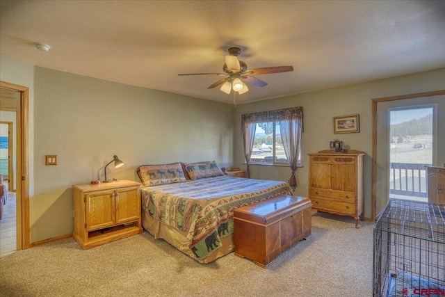 bedroom with baseboards, light carpet, access to exterior, and a ceiling fan