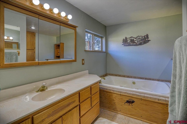 full bath featuring vanity and a jetted tub