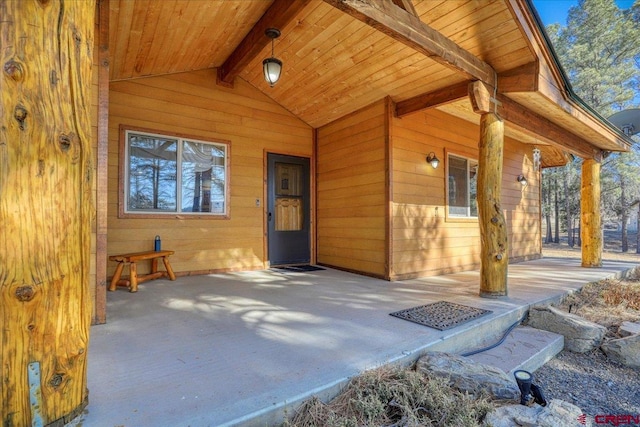 property entrance featuring a patio area