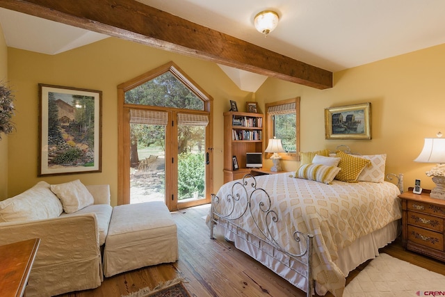 bedroom with access to exterior, lofted ceiling with beams, multiple windows, and wood finished floors