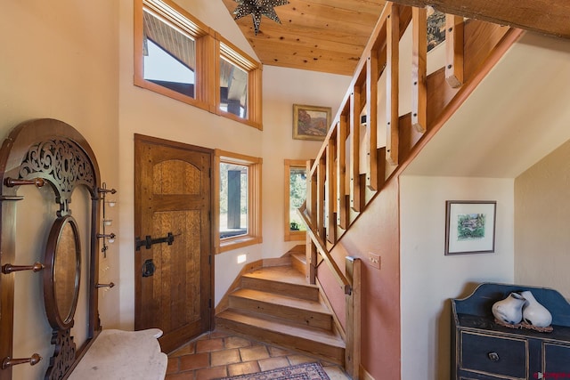 foyer with wood ceiling, stairs, and vaulted ceiling