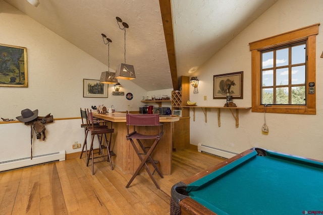 bar with a baseboard heating unit, lofted ceiling, and wood-type flooring