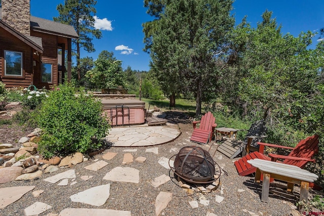 view of patio / terrace featuring a fire pit