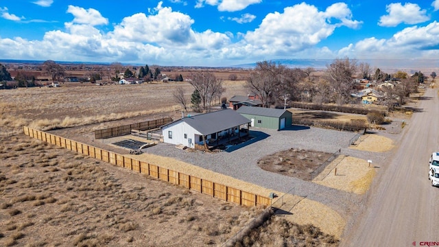 birds eye view of property with a rural view